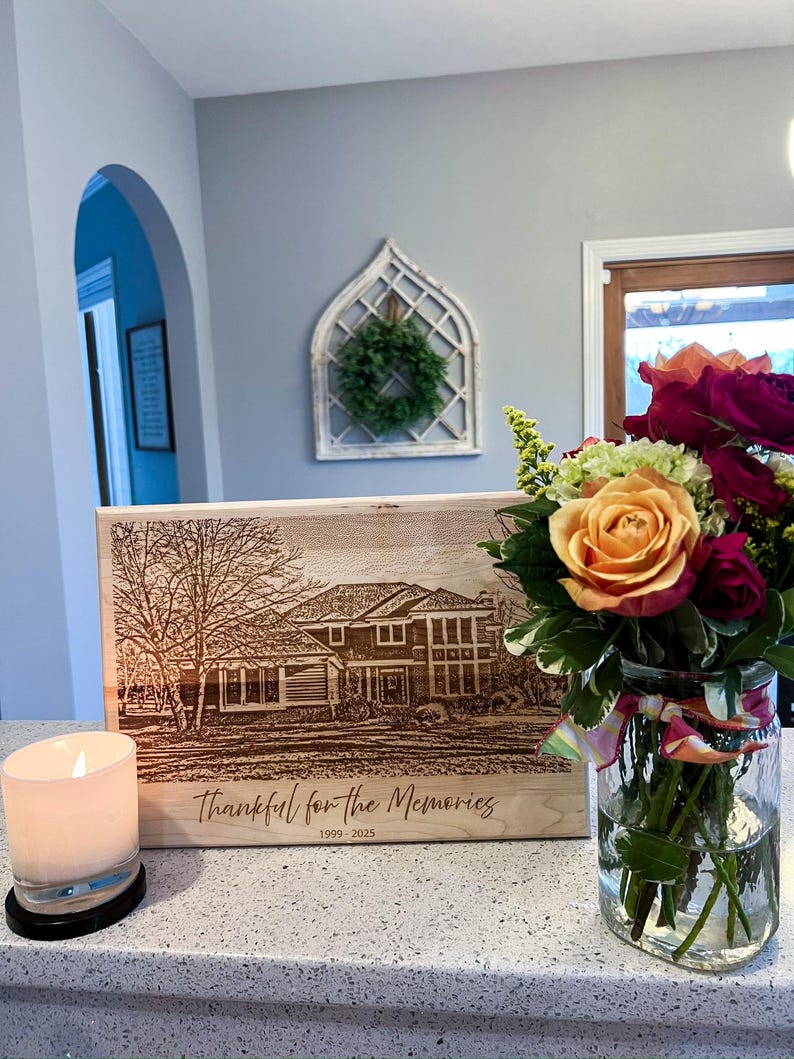 Personalized maple cutting board styled with flowers and a candle as a meaningful home gift